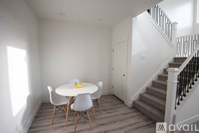 Lehi apartment for rent - A dining room with a white table and chairs.