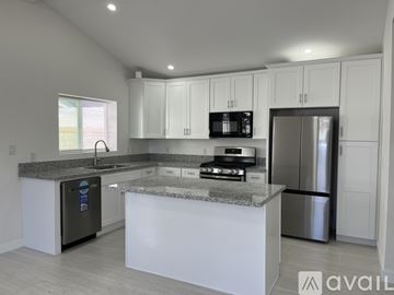Hawthorne apartment for rent - A modern kitchen with granite countertops and stainless steel appliances.