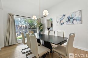 Frisco house for rent - A modern dining room with a large table and chairs.
