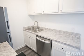Maple Heights apartment for rent - A kitchen with a sink and a dishwasher.