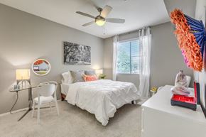 San Diego apartment for rent - a bedroom with a bed and a ceiling fan