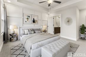 Parkville house for rent - A bedroom with two beds and a ceiling fan.