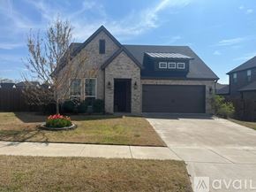 Cave Springs house for rent - A house with a garage and a driveway in front.