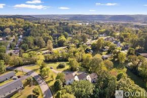 Ashland City apartment for rent - A bird's eye view of a residential area with houses and trees.
