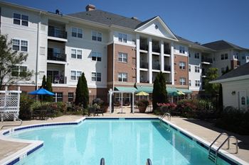 Outdoor recreation area with heated pool, whirlpool, putting green and walking paths 