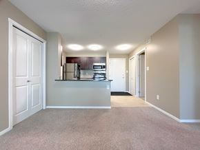 St. Albert apartment for rent - A kitchen area with a refrigerator, oven, and microwave.