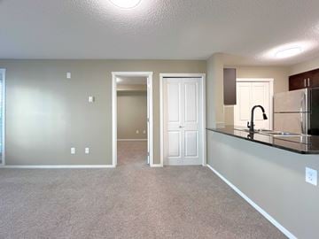St. Albert apartment for rent - A kitchen area with a sink and a refrigerator.