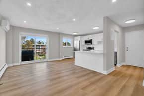 Waterloo apartment for rent - A spacious living room with a fireplace and a television.