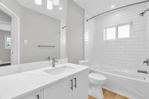 Waterloo apartment for rent - A white bathroom with a sink, toilet, and bathtub.