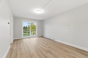 Kitchener apartment for rent - A room with a sliding glass door leading to a garden.