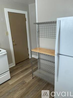 Rawlins apartment for rent - A kitchen with a white fridge and a white dishwasher.
