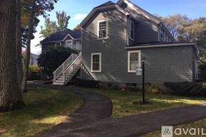 York apartment for rent - A house with a grey exterior and a tree in front of it.