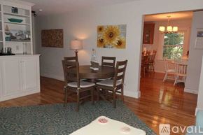 York apartment for rent - A dining room with a table set for four.