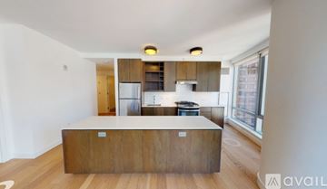 New York apartment for rent - A kitchen with a wooden island in the middle of the room.