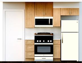 Cedar Grove apartment for rent - A modern kitchen with a white refrigerator, a black stove, and wooden cabinets.