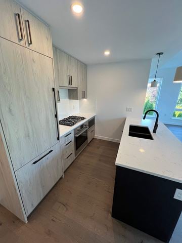 Vancouver apartment for rent - A kitchen with a white counter and wooden cabinets.