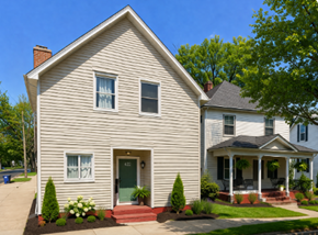 Wausau apartment for rent - A house with a green door and a porch.
