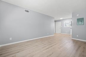 Atlanta apartment for rent - A room with wooden flooring and a grey wall.