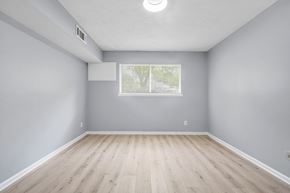 Atlanta apartment for rent - A room with a window and wooden flooring.