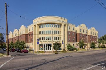 Memphis apartment for rent - A large building with a sign that says "Maple Woods Apartments West.".