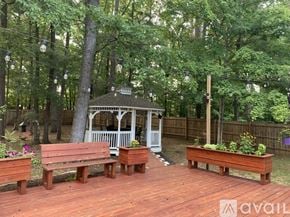 Durham house for rent - A gazebo is surrounded by benches and trees.