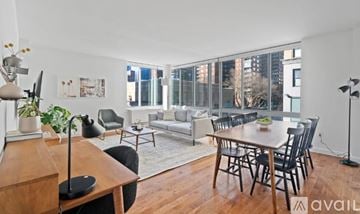 New York apartment for rent - A living room with a dining table and chairs.