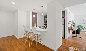 New York apartment for rent - A white room with a desk and chairs.