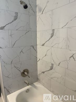 Sanford house for rent - A white sink in a bathroom with marble tiles.