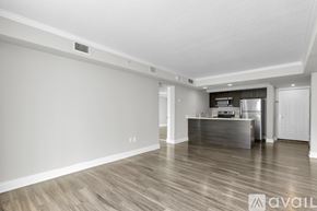 Kissimmee apartment for rent - A spacious kitchen with a refrigerator, microwave, and oven.
