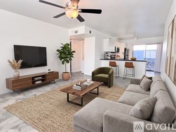 Phoenix apartment for rent - A kitchen with white cabinets and a black oven.