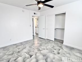 Phoenix apartment for rent - A white building with a balcony and a door.