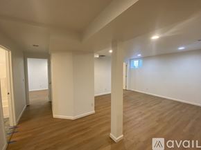 Seattle house for rent - A white washing machine with a pink top is in a room.
