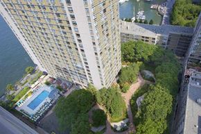 New York apartment for rent - an aerial view of a building with a pool and trees