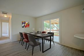 Colorado City house for rent - A dining room with a table set for two and a painting on the wall.