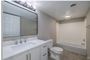 Springfield apartment for rent - A white bathroom with a sink, toilet, and bathtub.