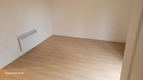 Bridgewater apartment for rent - A room with a wooden floor and a radiator on the wall.