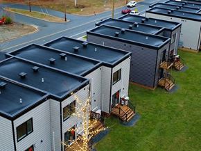 Bridgewater apartment for rent - A series of houses with black roofs are lined up in a row.