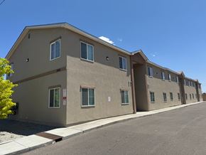 Albuquerque apartment for rent - A building with a parking lot in front of it.