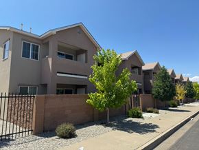 Albuquerque apartment for rent - A row of houses with a clear blue sky above them.