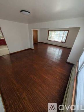 Belleville apartment for rent - A room with wooden flooring and a window.