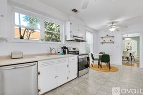 Savannah house for rent - A kitchen with white cabinets and a sink.
