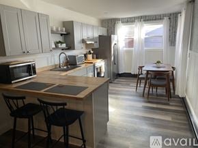 Ellsworth apartment for rent - A kitchen with a table and chairs in the middle of the room.