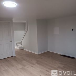 Claysburg apartment for rent - A room with wooden flooring and a white door.