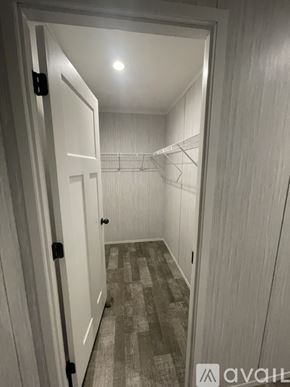 Harford house for rent - A hallway with a carpeted floor and a light on the ceiling.