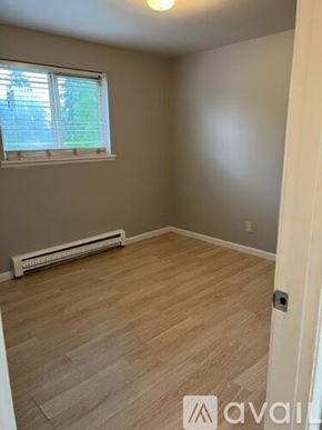 Sea Tac apartment for rent - A room with a window and a radiator on the floor.