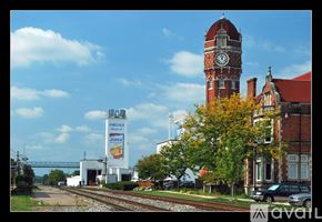 Chelsea apartment for rent - A train station with a clock tower and a Jiffy Lube sign.