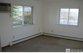 Chelsea apartment for rent - A room with a window and a wall heater.
