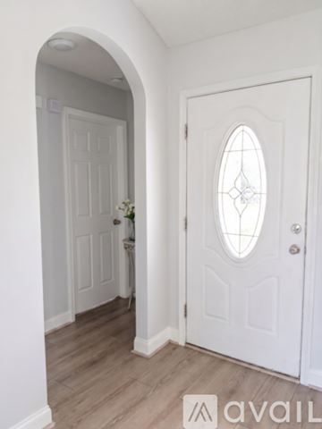 Raeford house for rent - Two black ovens sit side by side in a kitchen.