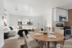 Los Angeles apartment for rent - A modern dining room with a wooden table set for two.