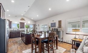 Hayden house for rent - A kitchen with a dining table and chairs in the middle of the room.